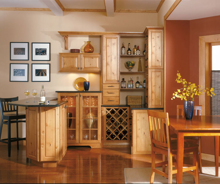 Rustic Alder cabinets in a home bar by Kemper Cabinetry